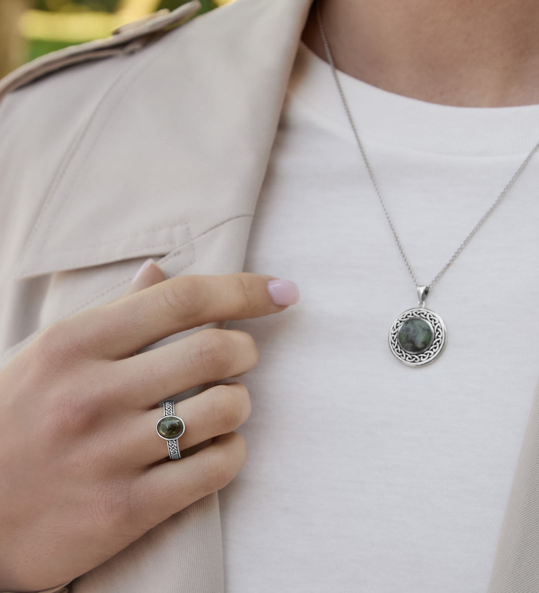 connemara marble celtic knot ring and necklace set on a model