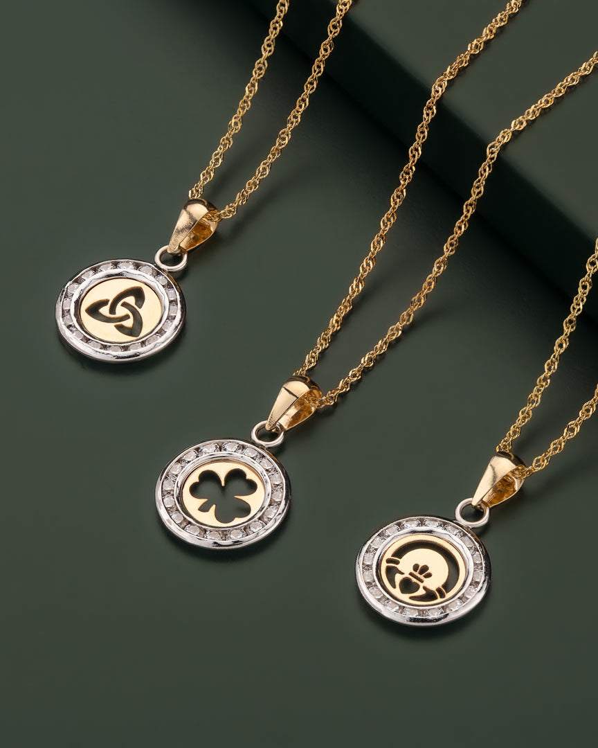set of gold cz celtic necklaces of a dark green background