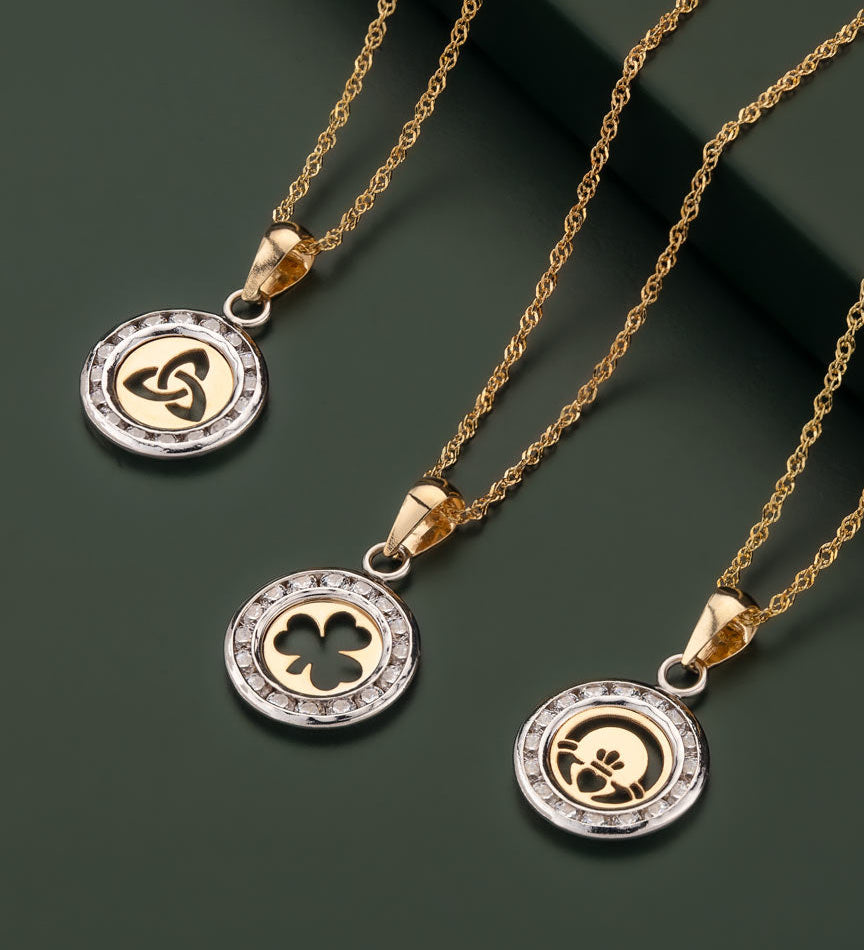 set of gold cz celtic necklaces of a dark green background