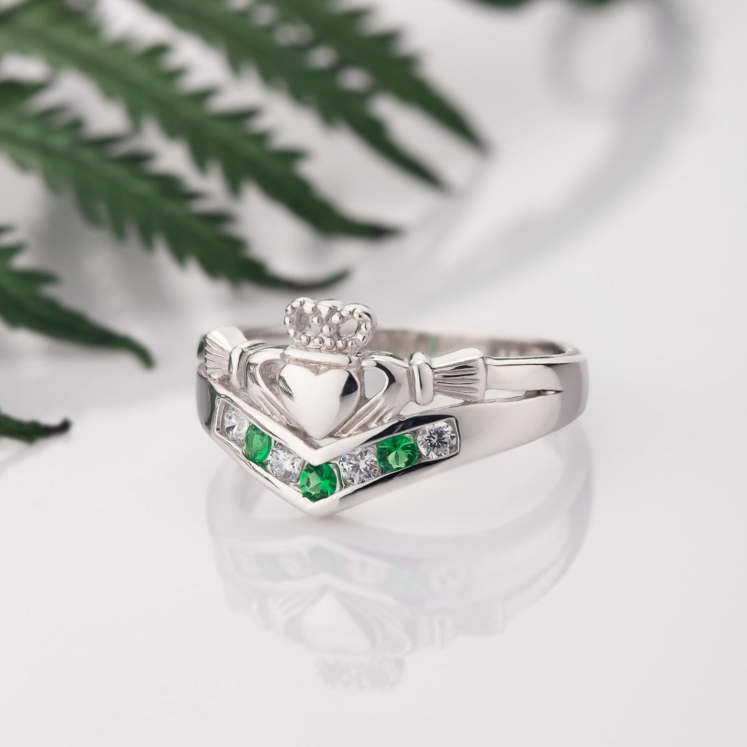 lifestyle image of Claddagh wishbone ring on white background