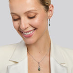 model wearing green marble Celtic knot necklace and earrings set from Solvar