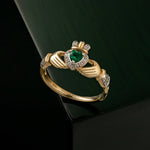styled image of diamond & emerald gold claddagh ring s21030