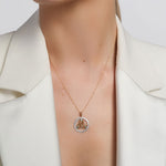 a model wearing yellow gold emerald celtic know necklace s46786