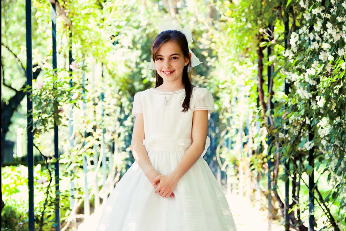 a girl in a first communion dress