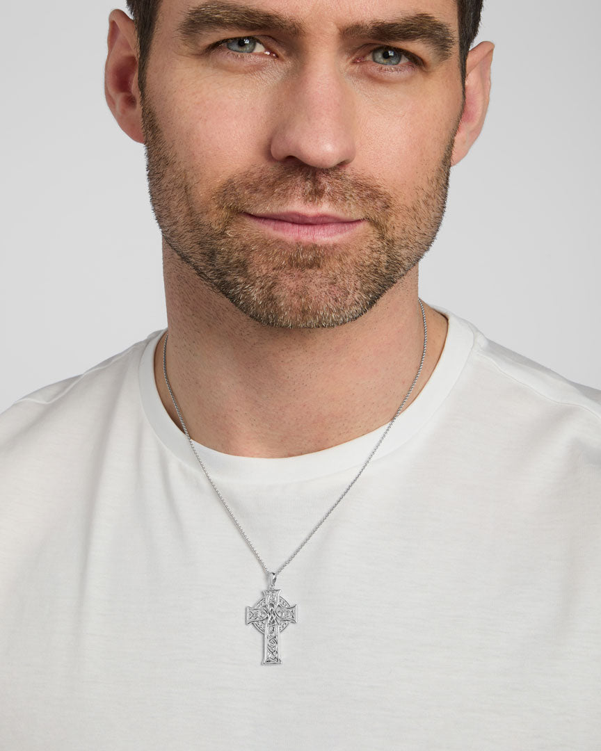 a male model wearing four Apostles' Celtic cross pendant from Solvar