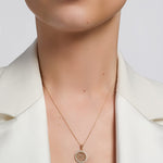 celtic round trinity knots necklace presented on a model