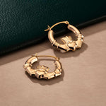 styled image of gold claddagh creole small earrings from Solvar