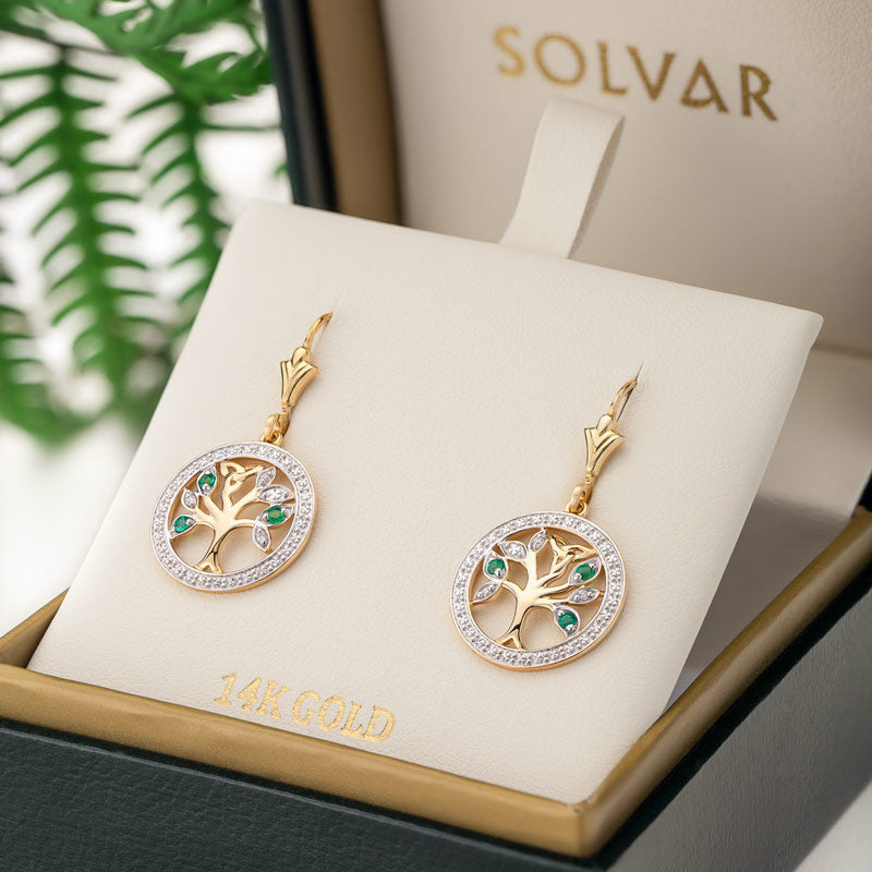 lifestyle image of gold tree of life earrings in Solvar gift box