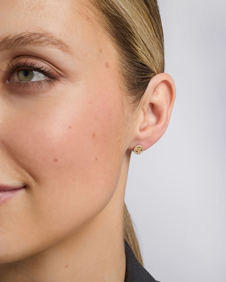 a model wearing Solvar cz set trinity knot stud earrings s34202