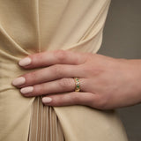 yellow gold Trinity Knot band ring on a model