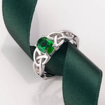 lifestyle image of green crystal trinity knot ring from Solvar