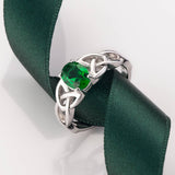 lifestyle image of green crystal trinity knot ring from Solvar