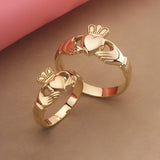 lifestyle image of matching heavy Claddagh rings for her and him