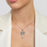 large celtic cross pendant with green marble centre on a model