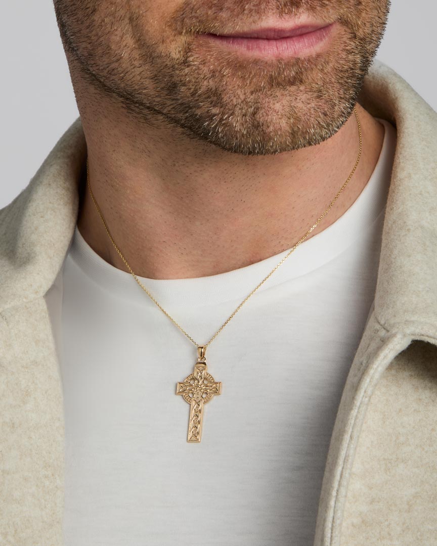 14k gold large celtic cross necklace on a male model