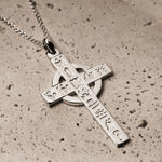 lifestyle image of large History of Ireland cross necklace in silver