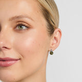 Connemara marble celtic stud earrings on a model