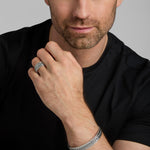 model wearing men's oxidised silver heavy Celtic Knot ring and bracelet from Solvar