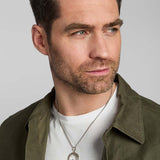 male model wearing gold and silver Celtic Claddagh pendant from Solvar
