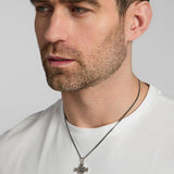a male model wearing mixed metal Celtic Cross pendant from Solvar