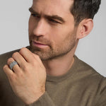 a model wearing silver men's heavy Celtic knot ring from Solvar
