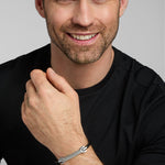 a model wearing mens narrow celtic black leather bracelet from Solvar