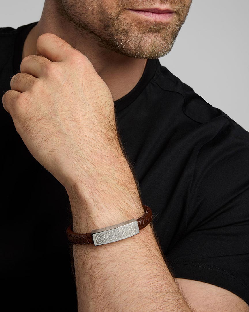 mens brown leather celtic bracelet on a model