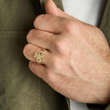 traditional men's gold Claddagh ring on a model