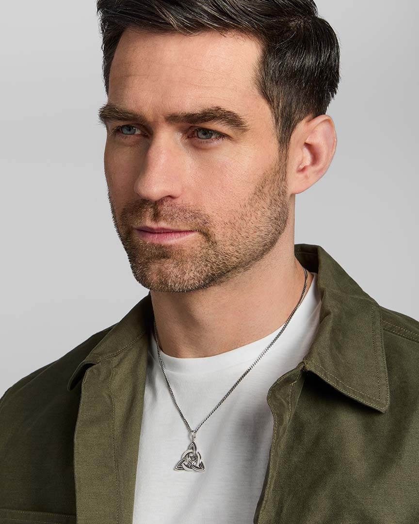 male model wearing oxidised silver large Celtic Knot pendant from Solvar