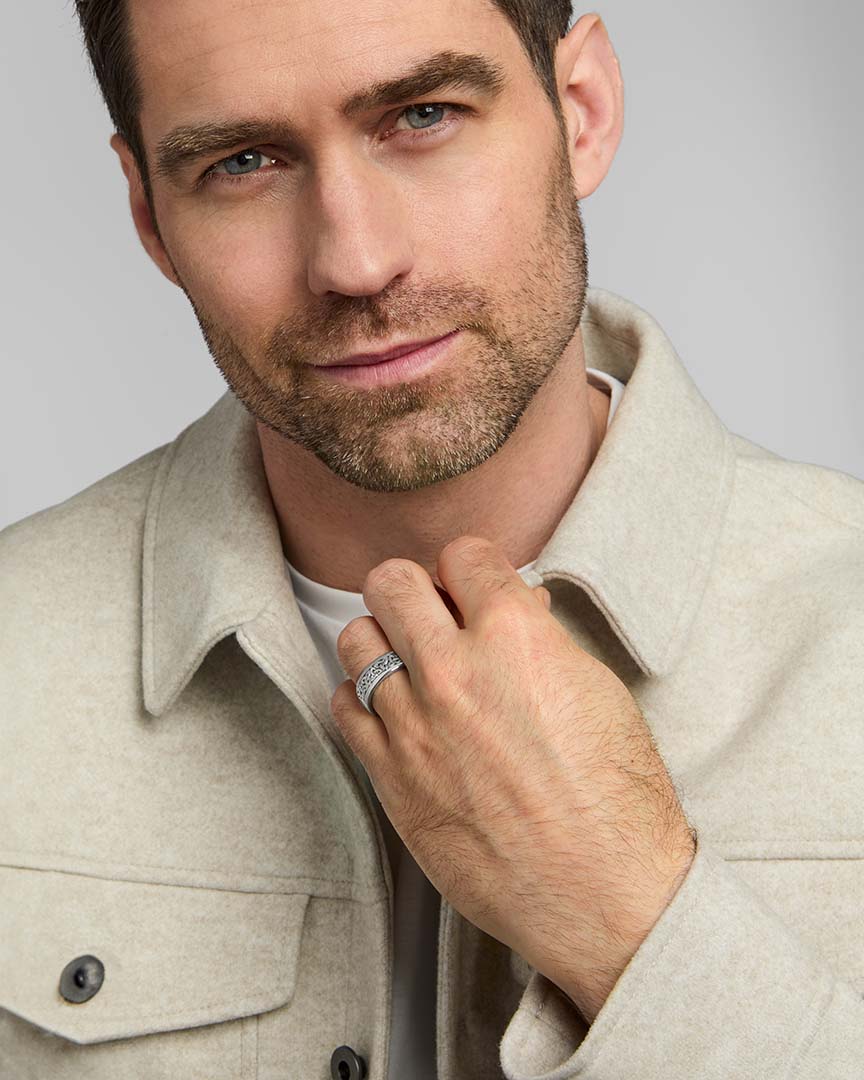 a male model wearing men's silver Trinity Knot band ring from Solvar