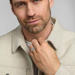 a male model wearing men's silver Trinity Knot band ring from Solvar