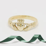gold Claddagh ring  on the turnable able