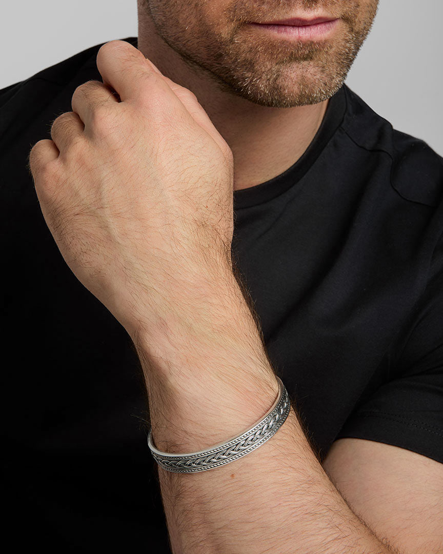 closeup image of men's heavy Celtic Knot bangle on a model