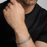 closeup image of men's heavy Celtic Knot bangle on a model