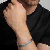 closeup image of men's heavy Celtic Knot bangle on a model