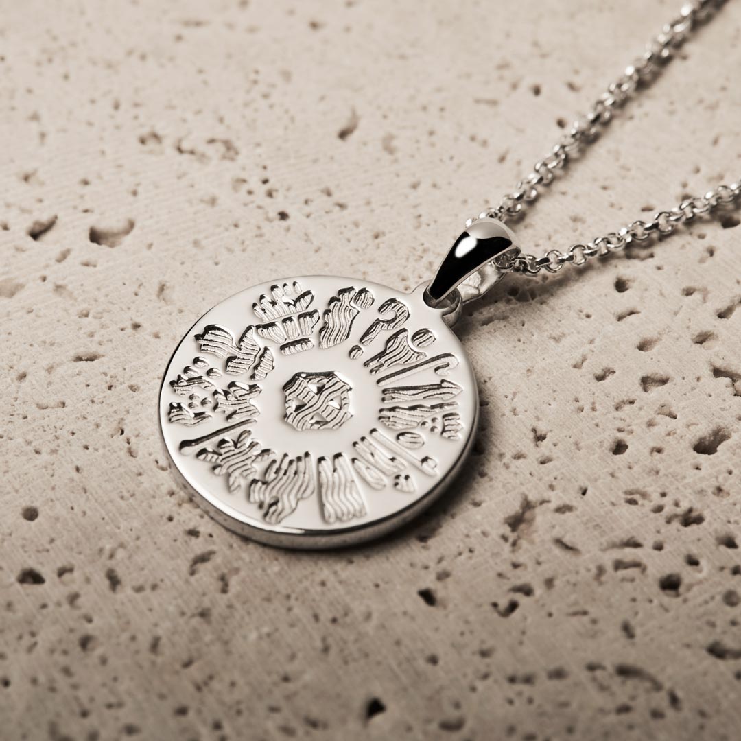 lifestyle image of history of Ireland disc pendant in silver