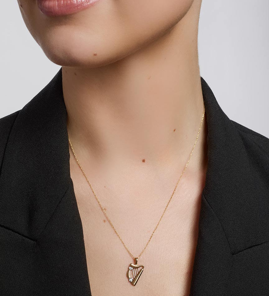 14k two tone gold harp pendant s44063 from Solvar on a model