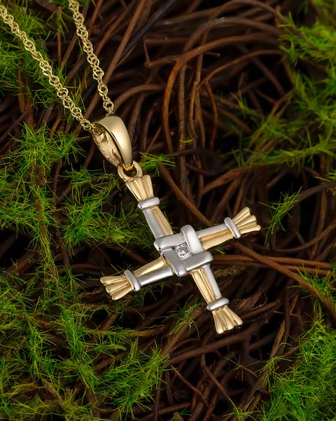 lifestyle image of two tone gold st brigids cross necklace