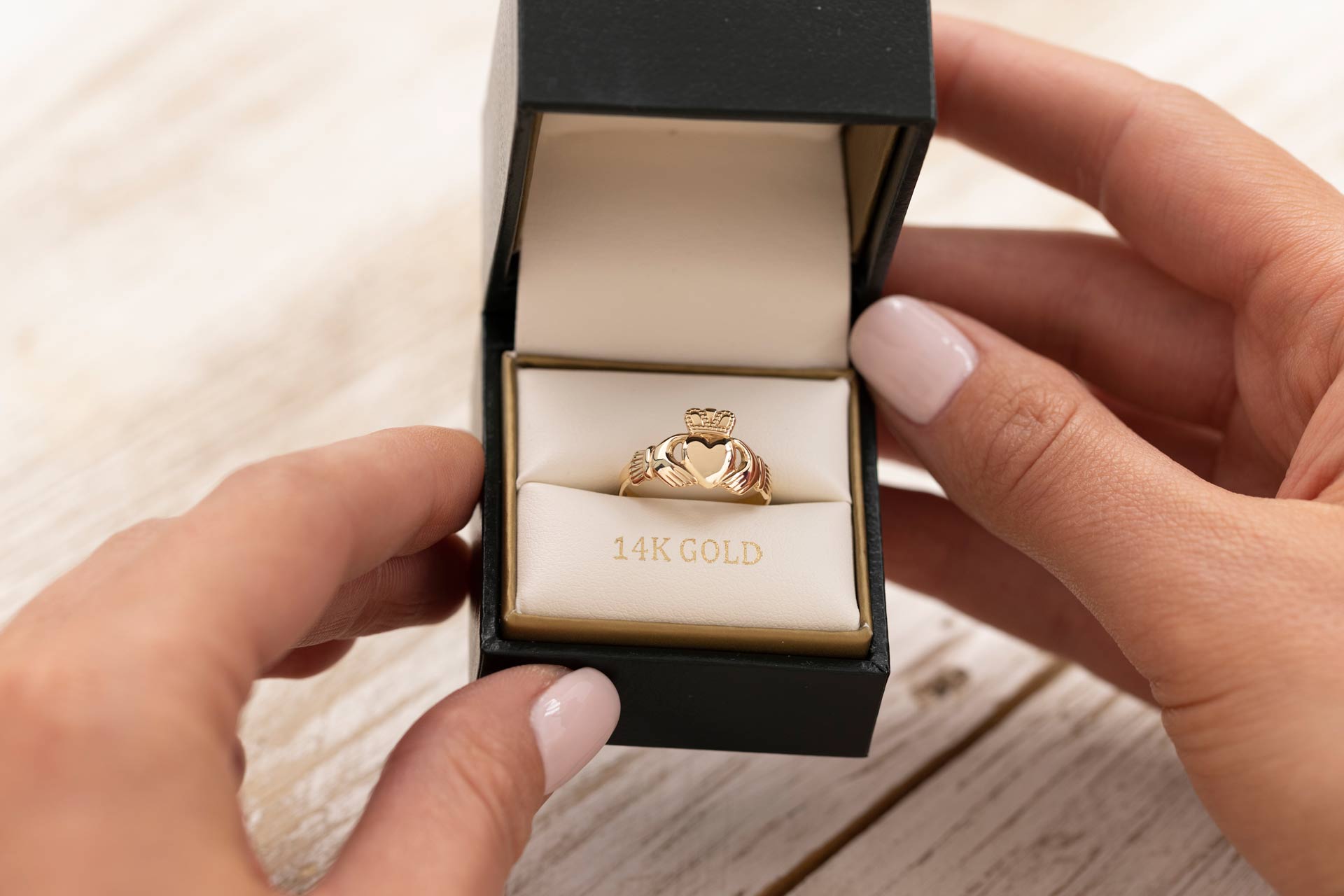 gold claddagh ring presented in branded solvar ring box