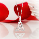 styled image of 14k white gold diamond trinity knot pendant s44415 from Solvar 2