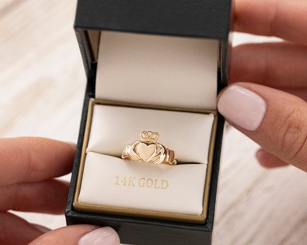 gold claddagh ring in a solvar branded ring box