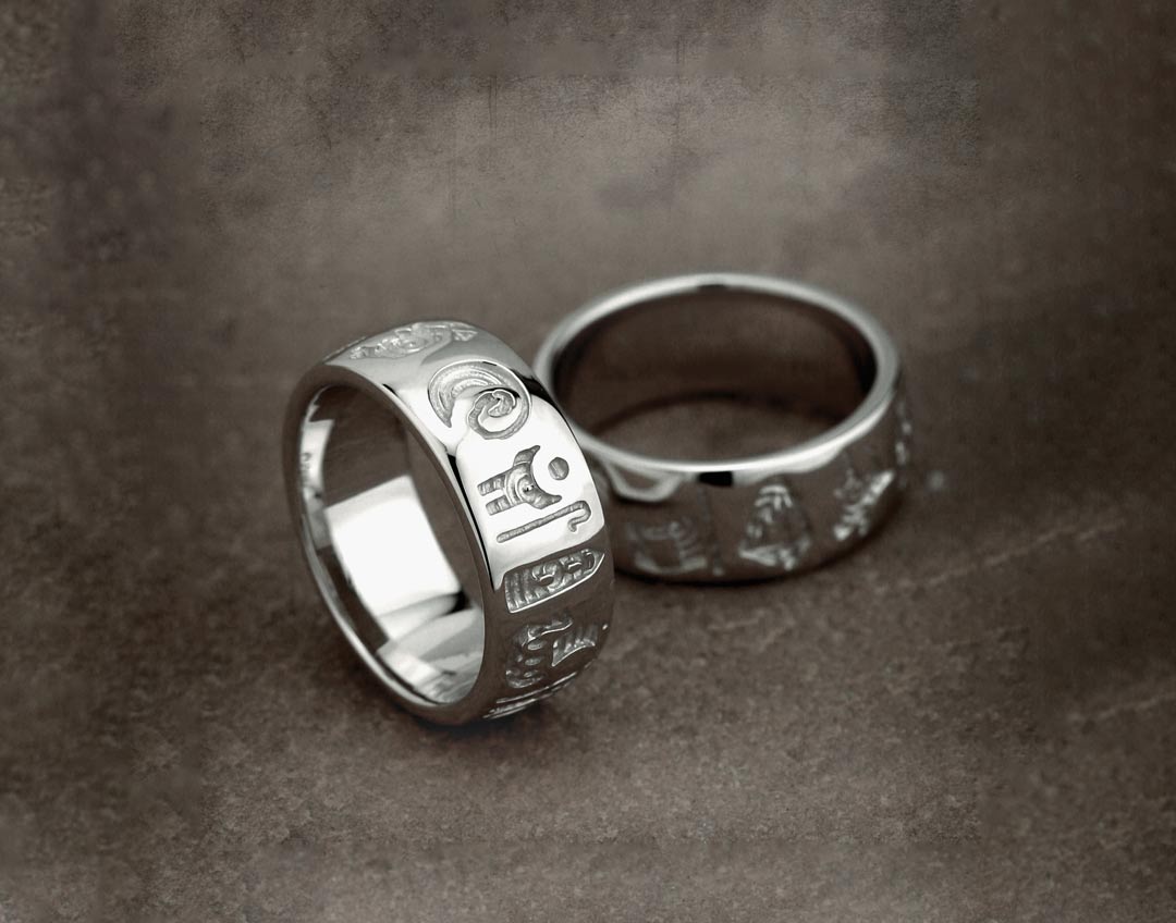 two history of ireland rings presented on a grey background