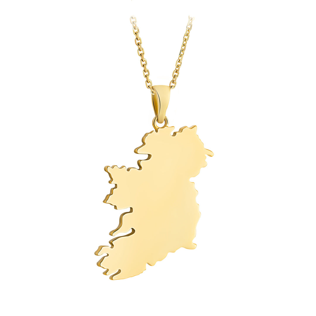 A gold necklace featuring a large pendant shaped like the map of Ireland, suspended from a delicate gold chain against a plain white background