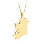 A gold necklace featuring a large pendant shaped like the map of Ireland, suspended from a delicate gold chain against a plain white background