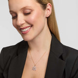Diamond heart and Celtic knot pendant necklace on model