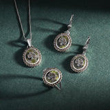 lifestyle image of matching connemara marble marcasite shamrock necklace, earrings, and ring