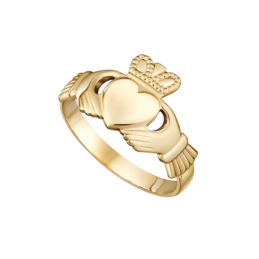 stock image of leight weight traditional gold Claddagh ring on the white background