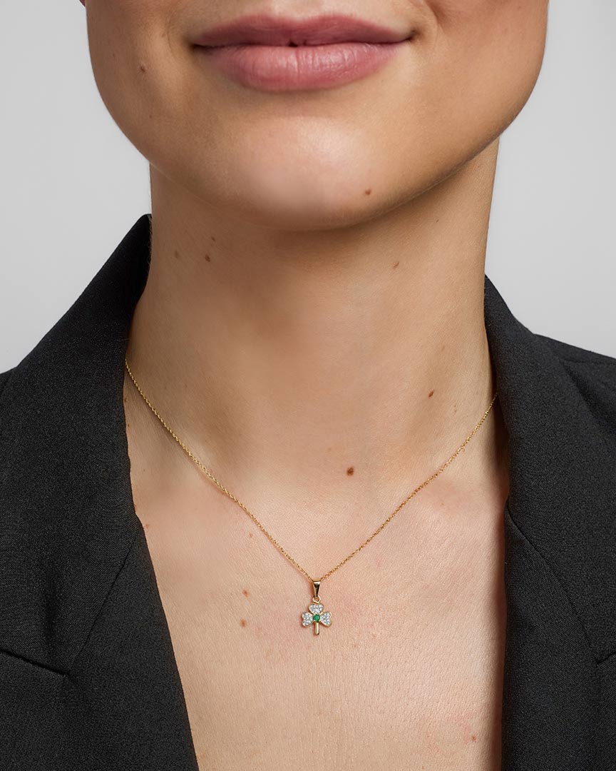 a model wearing gold diamond & emerald shamrock pendant s4512