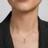a model wearing gold diamond & emerald shamrock pendant s4512