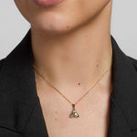 a model wearing emerald trinity knot pendant s4715